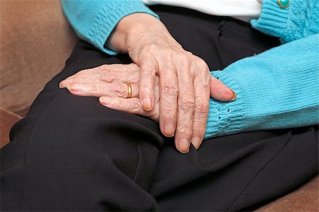 Old lady with one hand over the other resting on her lap also wearing a gold wedding ring. Stock Photo - Budget Royalty-Free & Subscription, Code: 400-07449254
