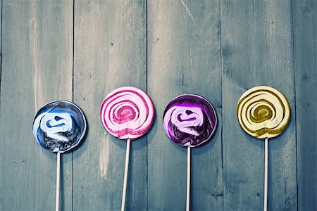 simsearch:400-07449438,k - Photo of 4 lollipops on wooden Stock Photo - Budget Royalty-Free & Subscription, Code: 400-07449437