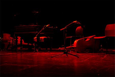 Stage bathed in red light ahead of a Hungarian Gypsy jazz concert Stock Photo - Budget Royalty-Free & Subscription, Code: 400-07449486