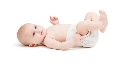 toddler in diaper lying on back. isolated on white background Foto de stock - Royalty-Free Super Valor e Assinatura, Número: 400-07449728