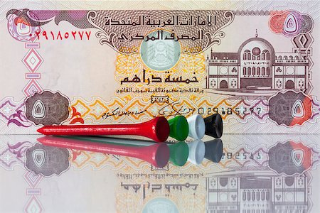 simsearch:400-07218299,k - Money and golf equipments in UAE  national colours Stock Photo - Budget Royalty-Free & Subscription, Code: 400-07450164