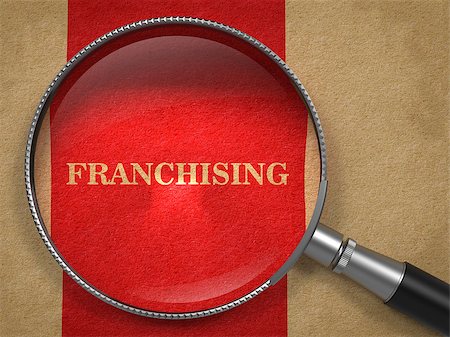 simsearch:400-07916756,k - Franchising Concept. Magnifying Glass on Old Paper with Red Vertical Line Background. Photographie de stock - Aubaine LD & Abonnement, Code: 400-07464332