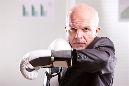 fighting business man upright and ready with white gloves Stock Photo - Budget Royalty-Free & Subscription, Code: 400-07464658