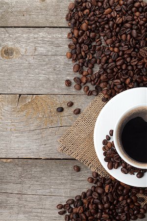 simsearch:400-04849433,k - Coffee cup and beans on wooden table background with copy space Stockbilder - Microstock & Abonnement, Bildnummer: 400-07465059