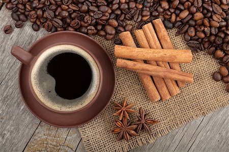 simsearch:400-07299272,k - Coffee cup and spices on wooden table texture Fotografie stock - Microstock e Abbonamento, Codice: 400-07465061