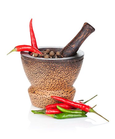 simsearch:400-04846756,k - Mortar and pestle with red hot chili pepper and peppercorn. Isolated on white background Stock Photo - Budget Royalty-Free & Subscription, Code: 400-07465128