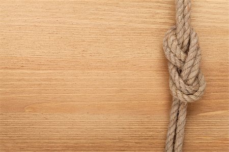 simsearch:400-08050300,k - Ship rope knot on wooden texture background Foto de stock - Super Valor sin royalties y Suscripción, Código: 400-07465175