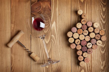 stopper - Red wine glass, corkscrew and grape shaped corks on wooden table background Stock Photo - Budget Royalty-Free & Subscription, Code: 400-07465191
