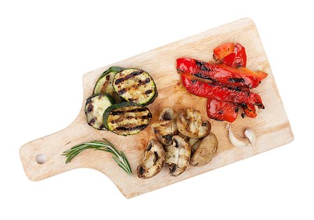 roasted pepper isolated - Grilled vegetables on cutting board. Isolated on white background Stock Photo - Budget Royalty-Free & Subscription, Code: 400-07465214