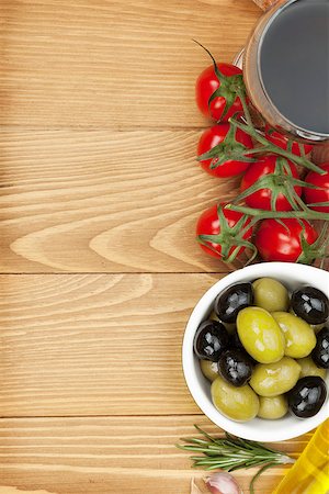 simsearch:400-07481817,k - Red wine with olives, tomatoes and spices. Over wooden table background. View from above with copy space Stock Photo - Budget Royalty-Free & Subscription, Code: 400-07465265