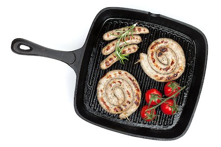 simsearch:695-05773485,k - Grilled sausages on frying pan. Isolated on white background Foto de stock - Royalty-Free Super Valor e Assinatura, Número: 400-07465289