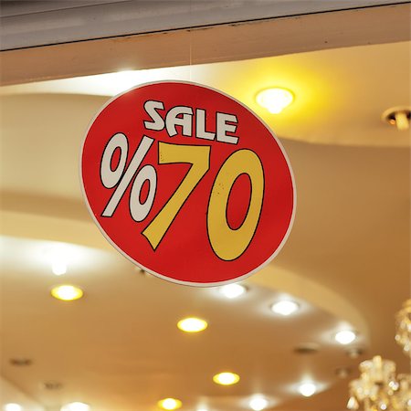 reduced sign in a shop - sale sign discount 70 percent Stock Photo - Budget Royalty-Free & Subscription, Code: 400-07465446