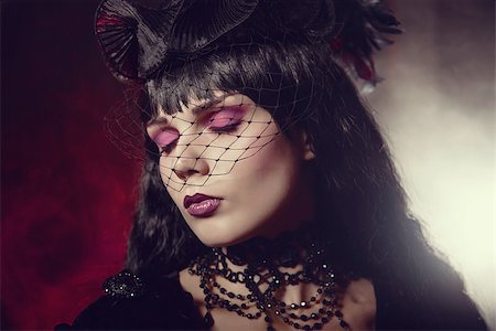 simsearch:400-07776243,k - Portrait of romantic gothic girl with artistic makeup wearing black beaded jewelry Fotografie stock - Microstock e Abbonamento, Codice: 400-07465487