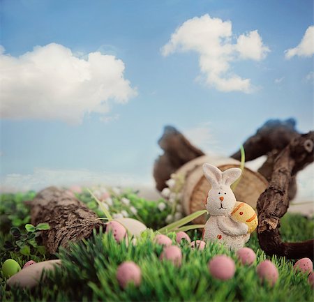 Colorful Easter eggs. Holiday nature concept with easter hunt. Eggs in the sunny meadow Stock Photo - Budget Royalty-Free & Subscription, Code: 400-07465810