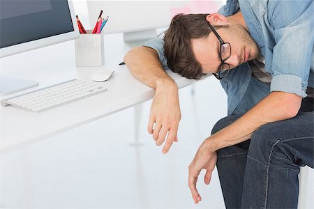 simsearch:400-07466593,k - Young casual man sleeping in front of computer at a bright office Stock Photo - Budget Royalty-Free & Subscription, Code: 400-07466445