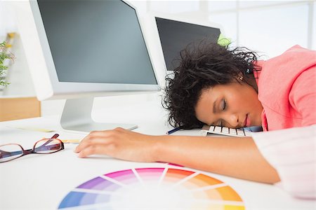 simsearch:400-07466593,k - Side view of a female artist with head resting on keyboard in the office Stock Photo - Budget Royalty-Free & Subscription, Code: 400-07466498