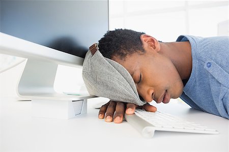 simsearch:400-07466593,k - Side view of a male artist with head resting on keyboard in the office Stock Photo - Budget Royalty-Free & Subscription, Code: 400-07466594