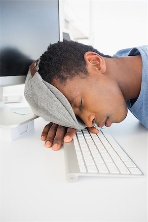 simsearch:400-07466593,k - Side view of a male artist with head resting on keyboard in the office Stock Photo - Budget Royalty-Free & Subscription, Code: 400-07466595