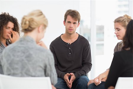 simsearch:400-07273405,k - Serious rehab group at a session at therapy Fotografie stock - Microstock e Abbonamento, Codice: 400-07467065