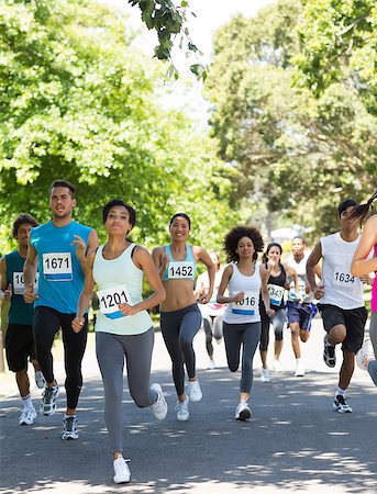 runner women group - Group of marathon athletes running on street Stock Photo - Budget Royalty-Free & Subscription, Code: 400-07467553