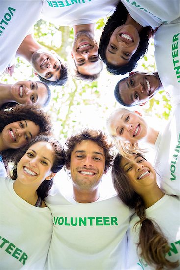 Low angle portrait of multiethnic environmentalists forming huddle Stock Photo - Royalty-Free, Artist: 4774344sean, Image code: 400-07467604