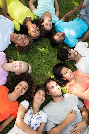 people lying in circle - High angle view of a group of friends lying down in a circle at park Stock Photo - Budget Royalty-Free & Subscription, Code: 400-07467680