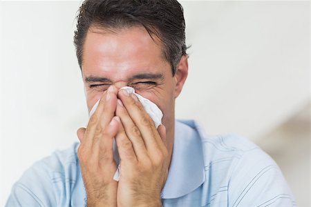 simsearch:6109-07601488,k - Closeup of a man suffering from cold with eyes closed Stock Photo - Budget Royalty-Free & Subscription, Code: 400-07467936