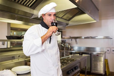 simsearch:400-09222970,k - Side view of a male cook drinking red wine in the kitchen Stock Photo - Budget Royalty-Free & Subscription, Code: 400-07468078