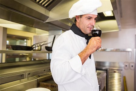 simsearch:400-09222970,k - Side view of a male cook drinking red wine in the kitchen Stock Photo - Budget Royalty-Free & Subscription, Code: 400-07468080