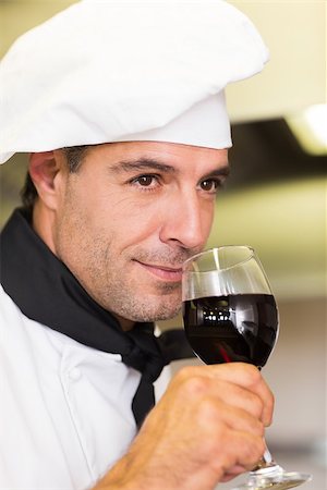 simsearch:400-07468062,k - Closeup of a male chef smelling red wine in the kitchen Stockbilder - Microstock & Abonnement, Bildnummer: 400-07468082