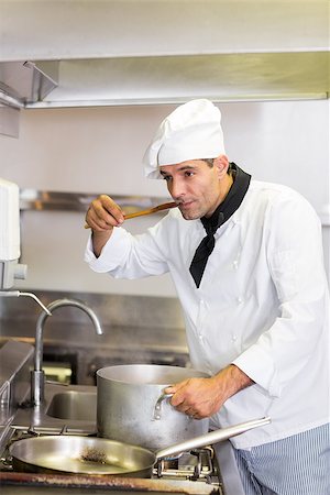 simsearch:400-07468062,k - Concentrated young male cook tasting food in the kitchen Stockbilder - Microstock & Abonnement, Bildnummer: 400-07468107