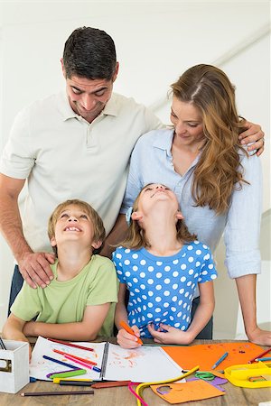 Children looking at parents while coloring Stock Photo - Budget Royalty-Free & Subscription, Code: 400-07468323