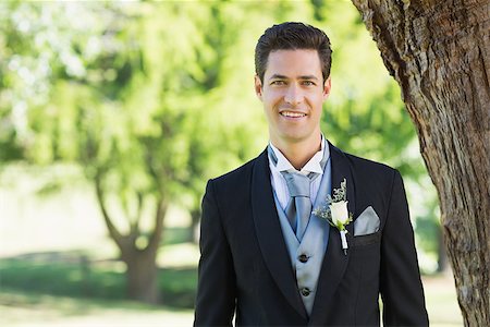 Portrait of young groom smiling at garden Stock Photo - Budget Royalty-Free & Subscription, Code: 400-07468441