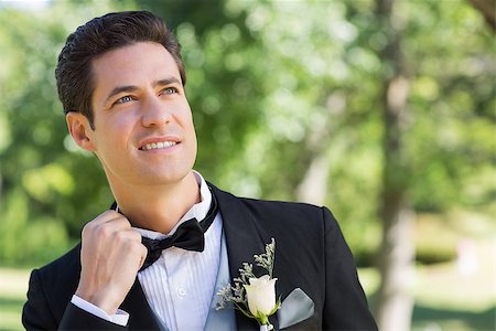 Nervous groom looking up in garden Stock Photo - Budget Royalty-Free & Subscription, Code: 400-07468464