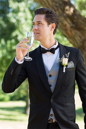 Young thoughtful bridegroom drinking champagne in garden Stock Photo - Budget Royalty-Free & Subscription, Code: 400-07468478