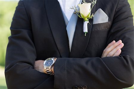 Midsection closeup of confident bridegroom with arms crossed Stock Photo - Budget Royalty-Free & Subscription, Code: 400-07468473