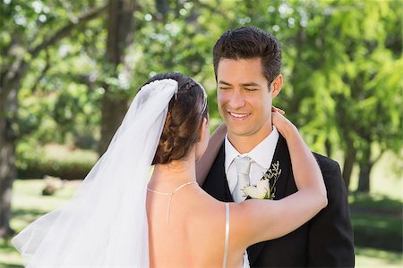 simsearch:400-07473234,k - Handsome young groom embracing woman in garden Stock Photo - Budget Royalty-Free & Subscription, Code: 400-07468579