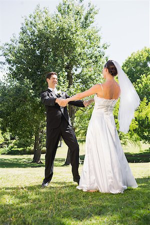 simsearch:400-07473236,k - Happy young bride and groom enjoying in park Stockbilder - Microstock & Abonnement, Bildnummer: 400-07468584