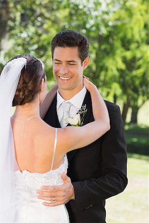 simsearch:400-07473234,k - Smart young groom embracing woman in garden Stock Photo - Budget Royalty-Free & Subscription, Code: 400-07468580