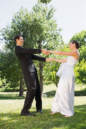 simsearch:400-07473236,k - Happy newly wed couple enjoying in park Stockbilder - Microstock & Abonnement, Bildnummer: 400-07468583