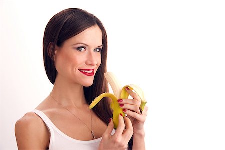 pretty women eating banana - Attractive  Woman eats RAW banana Photographie de stock - Aubaine LD & Abonnement, Code: 400-07461738