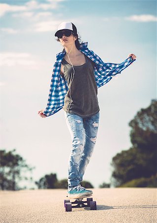 fun fashion street - Young woman down the road with a skateboard Stock Photo - Budget Royalty-Free & Subscription, Code: 400-07462892