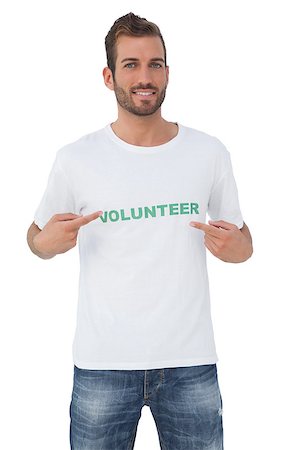 Portrait of a happy male volunteer pointing to himself over white background Stockbilder - Microstock & Abonnement, Bildnummer: 400-07474806