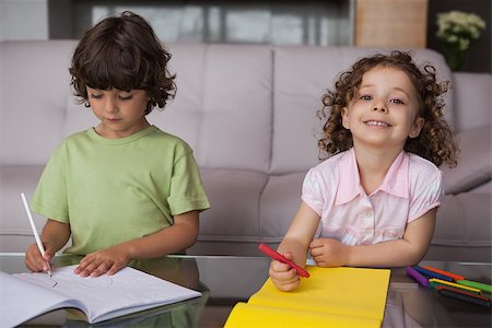 simsearch:6109-07601494,k - Portrait of siblings drawing in the living room at home Stock Photo - Budget Royalty-Free & Subscription, Code: 400-07475217