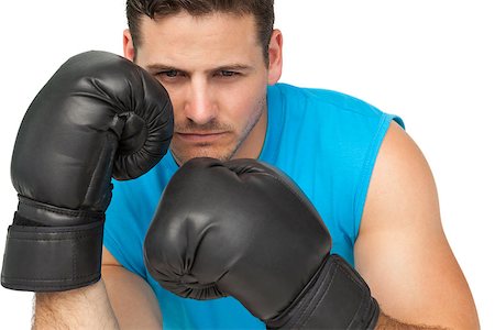Close-up of a determined male boxer focused on his training over white background Stock Photo - Budget Royalty-Free & Subscription, Code: 400-07475587