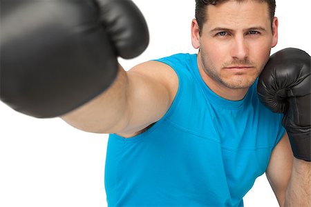 simsearch:400-07143098,k - Close-up of a determined male boxer focused on his training over white background Stock Photo - Budget Royalty-Free & Subscription, Code: 400-07475588