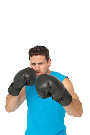 simsearch:400-07143098,k - Determined male boxer focused on his training over white background Stock Photo - Budget Royalty-Free & Subscription, Code: 400-07475596