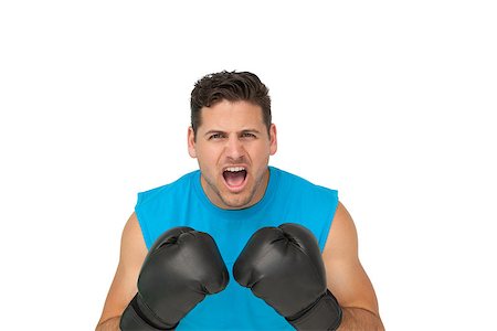 simsearch:400-06876600,k - Close-up portrait of a determined male boxer screaming over white background Stock Photo - Budget Royalty-Free & Subscription, Code: 400-07475592