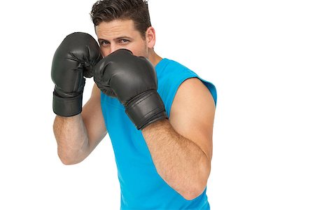 simsearch:400-07143098,k - Determined male boxer focused on his training over white background Stock Photo - Budget Royalty-Free & Subscription, Code: 400-07475600