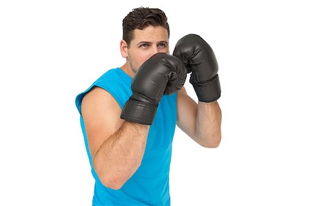 simsearch:400-07143098,k - Determined male boxer focused on his training over white background Stock Photo - Budget Royalty-Free & Subscription, Code: 400-07475601